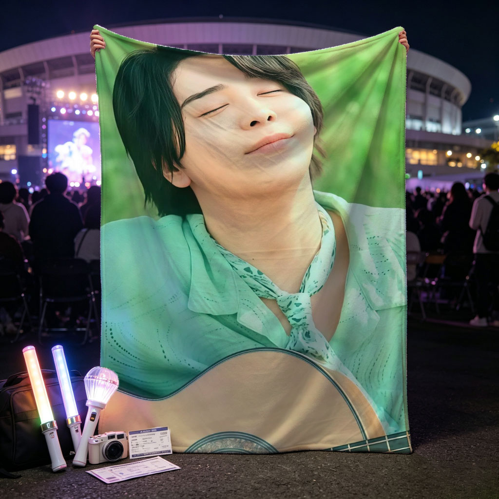 Yuki Kajiura in a Serene Outdoor Setting Playing Acoustic Guitar with Eyes Closed - Blankets