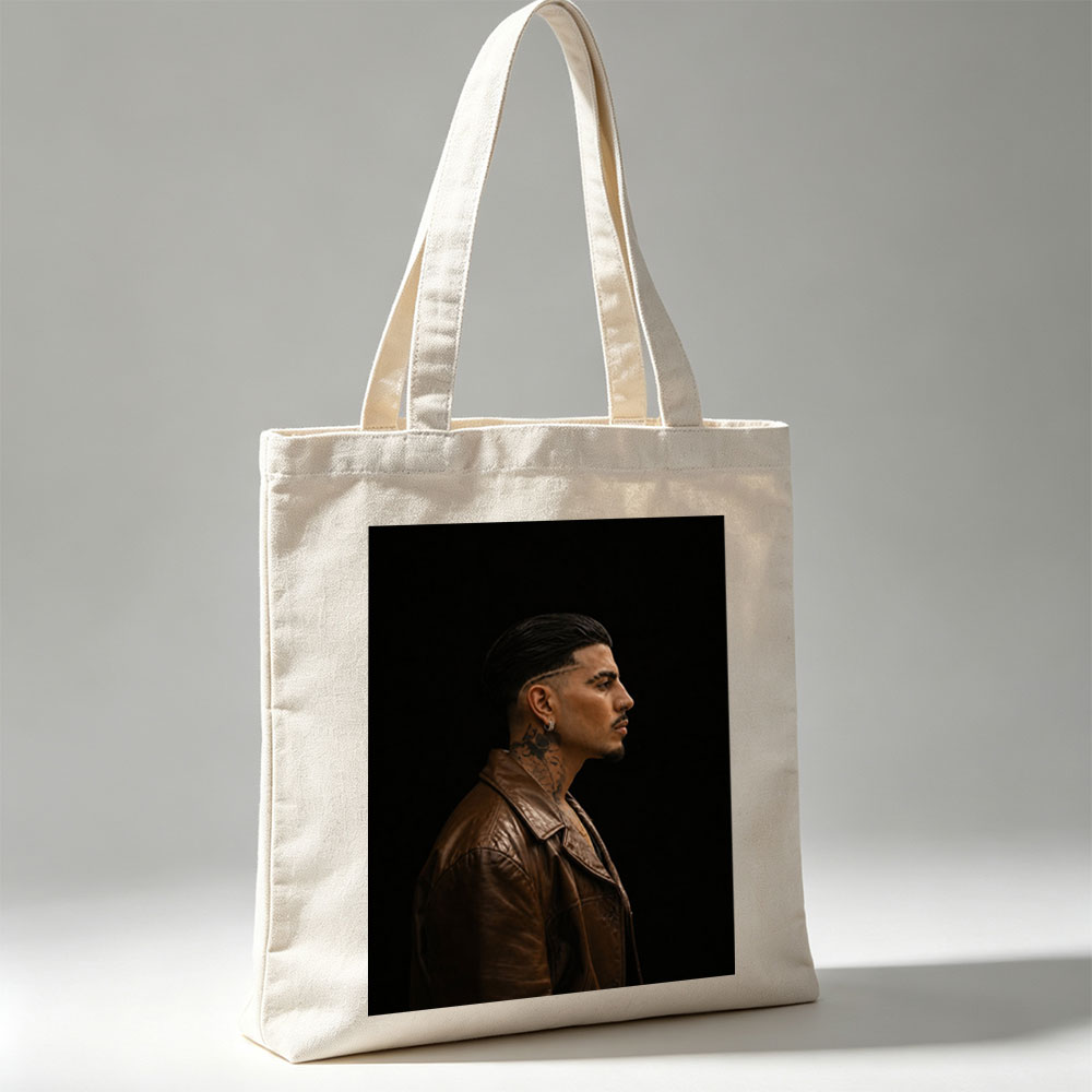 Bad Bunny in Profile Portrait Wearing Brown Leather Jacket Against Black Background - Canvas tote bags