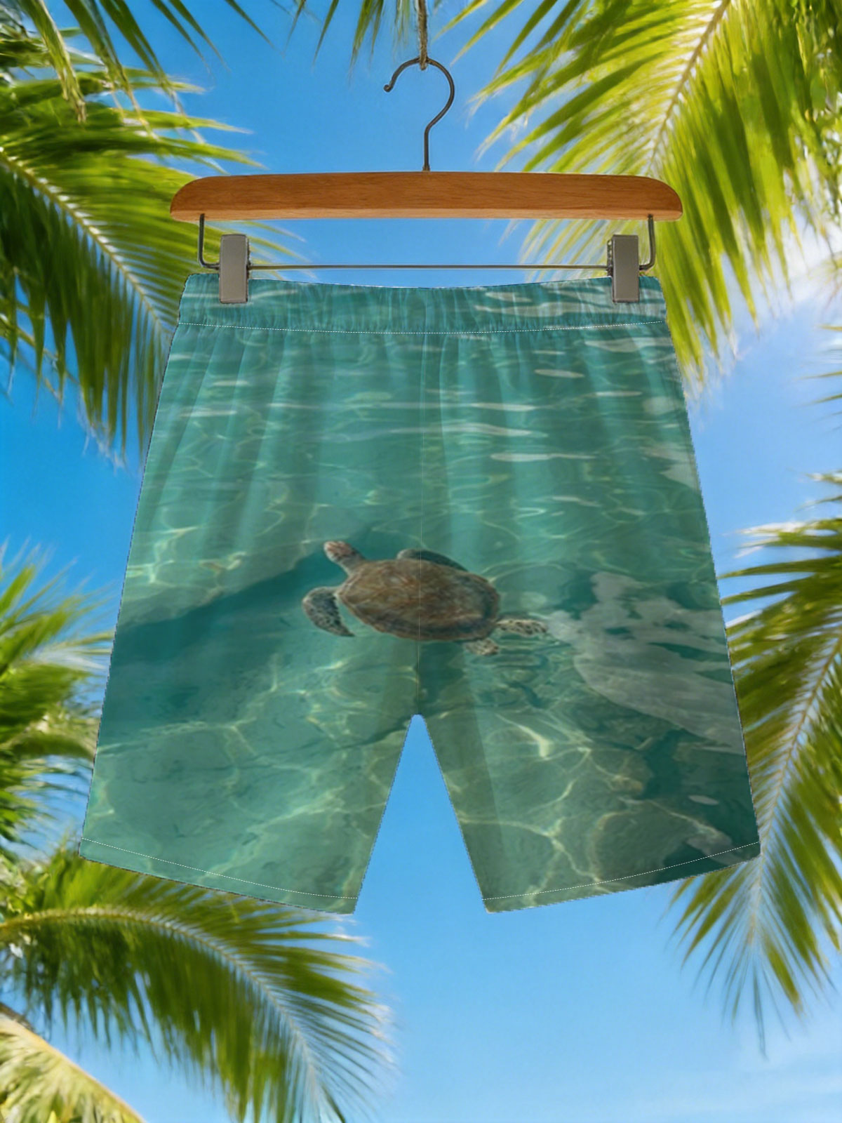 Sea turtle swimming in clear turquoise water -  Beach shorts