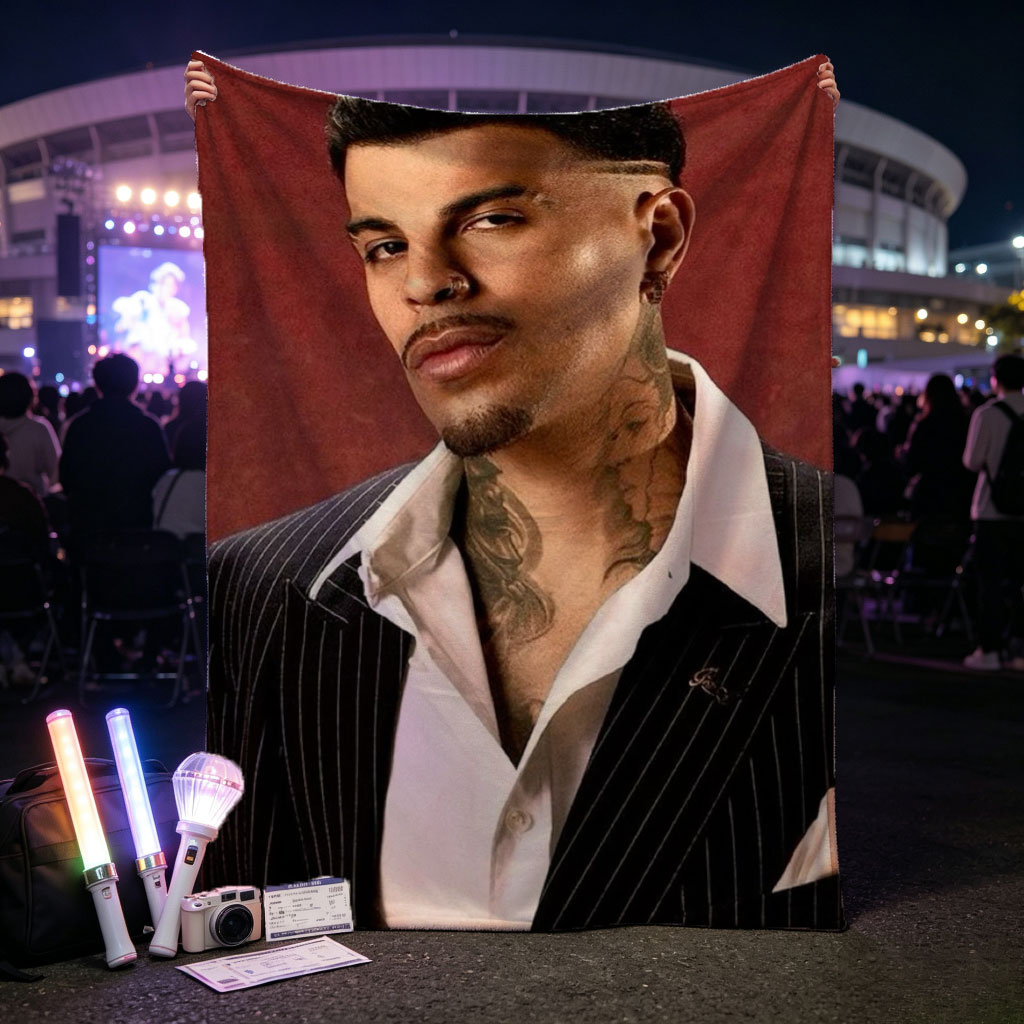 Maluma in a Pinstripe Suit with Visible Neck Tattoos Against a Red Background - Blankets