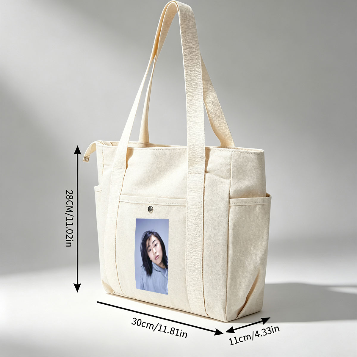 Yuki Kajiura in a Serene Portrait Wearing a Light Blue Collared Shirt Against a Soft Gray Background - Multi-pocket bags