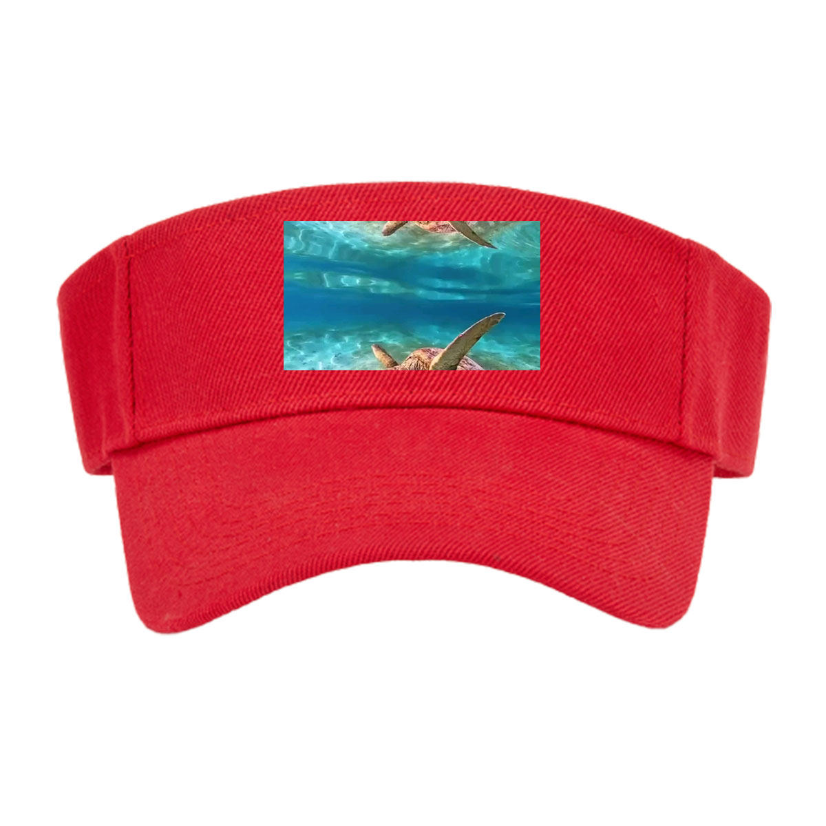 Sea turtles swim gracefully in clear blue waters, one near the surface and one gliding over sandy ocean floor. -  Visor cap