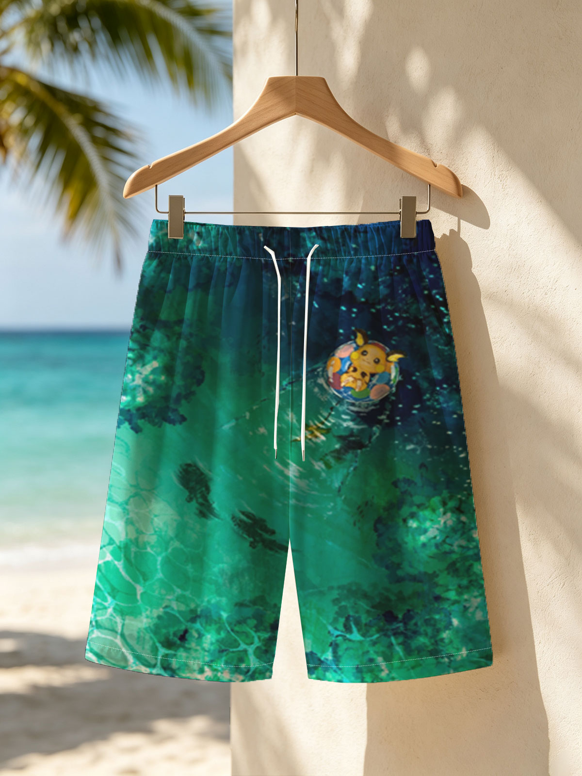 Pikachu floating on a colorful ring in a serene, turquoise pool with fish swimming below. -  Beach shorts