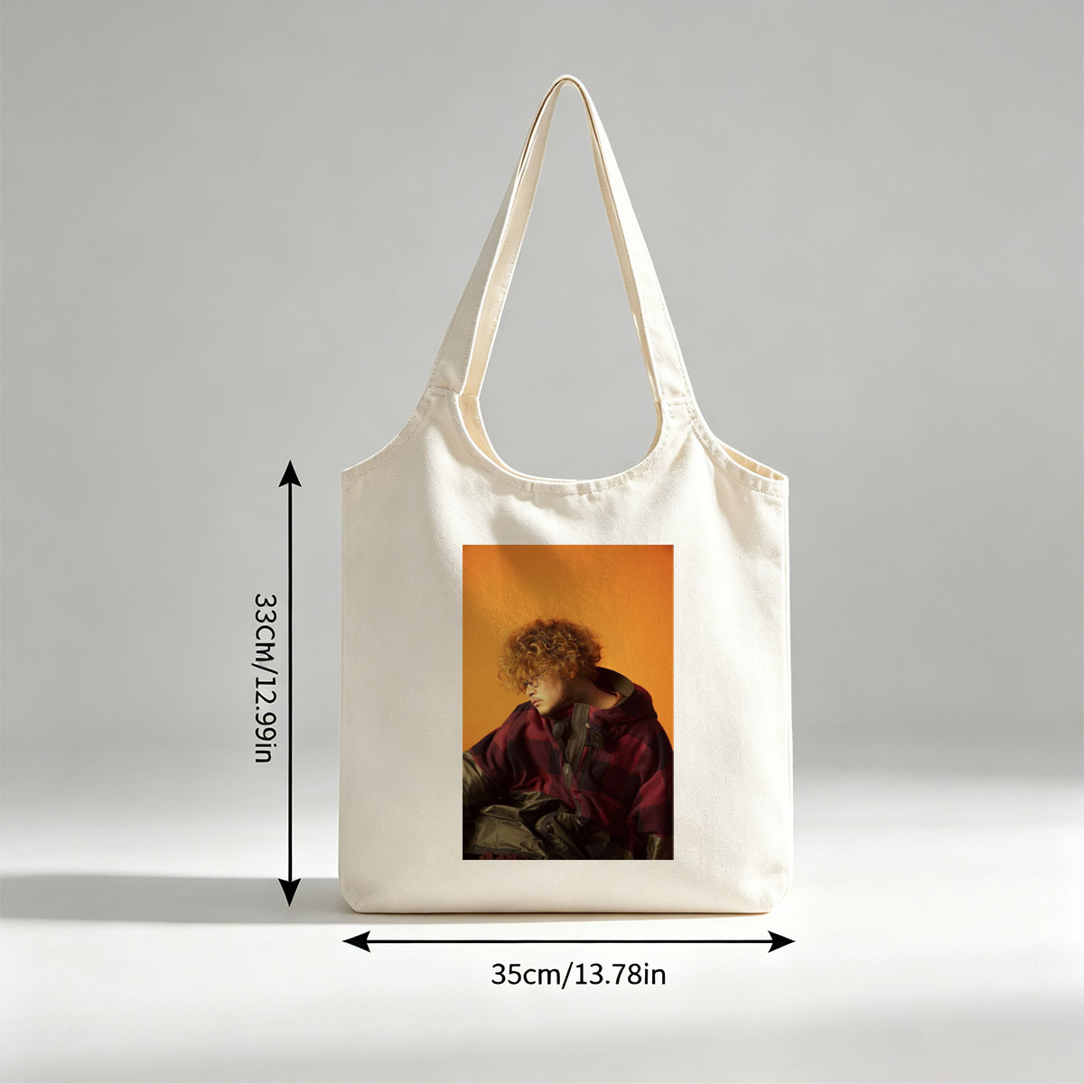 Takashi Miyagawa in a Moody Portrait Wearing a Plaid Hoodie Against an Orange Background - Canvas shoulder bags/