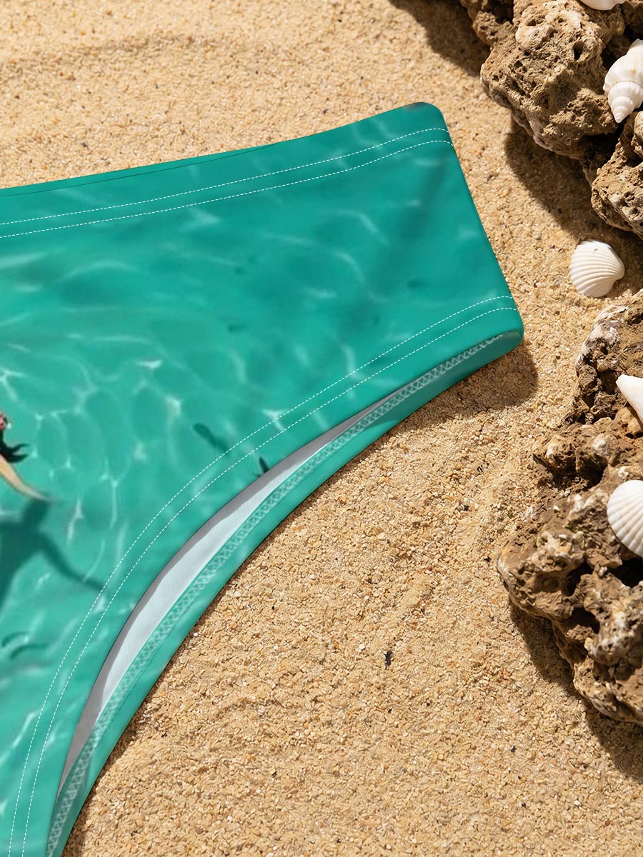 Woman swimming with sharks in clear turquoise water -  Men's swim trunks