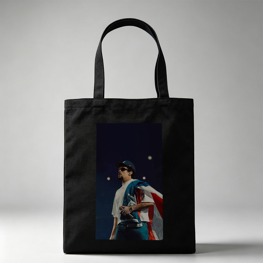 Bad Bunny Performing on Stage with Puerto Rican Flag Draped Over Shoulders - Canvas tote bags