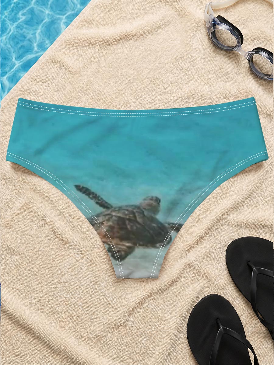 Sea turtle swimming in clear blue water over sandy ocean floor -  Men's swim trunks