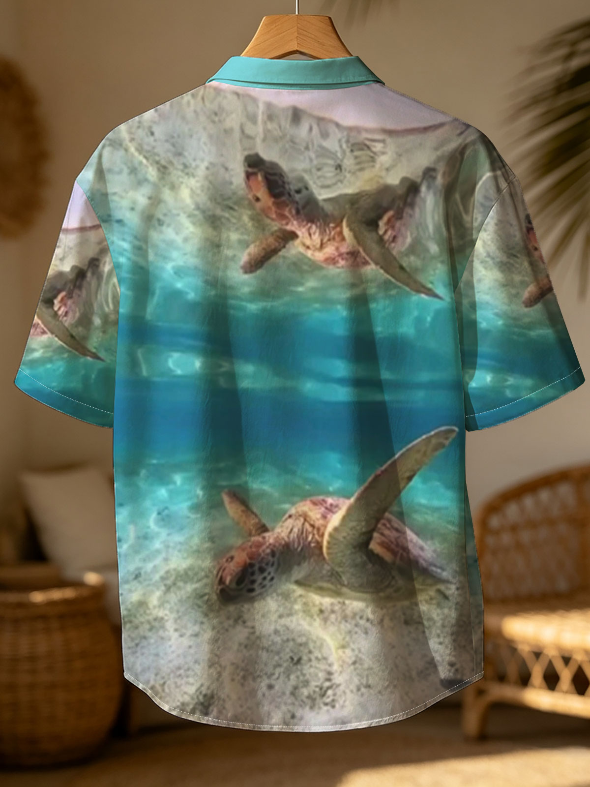 Sea turtles swim gracefully in clear blue waters, one near the surface and one gliding over sandy ocean floor. -  Shirt
