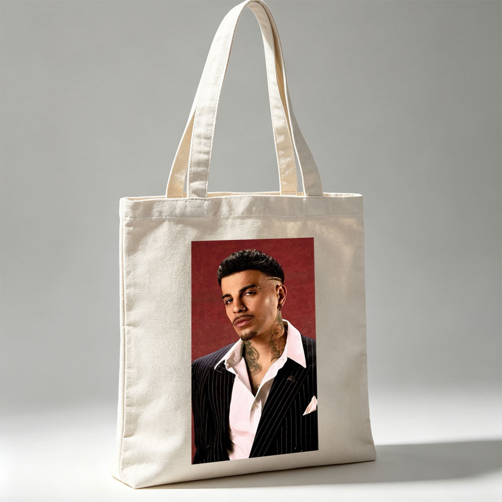 Maluma in a Pinstripe Suit with Visible Neck Tattoos Against a Red Background - Canvas tote bags