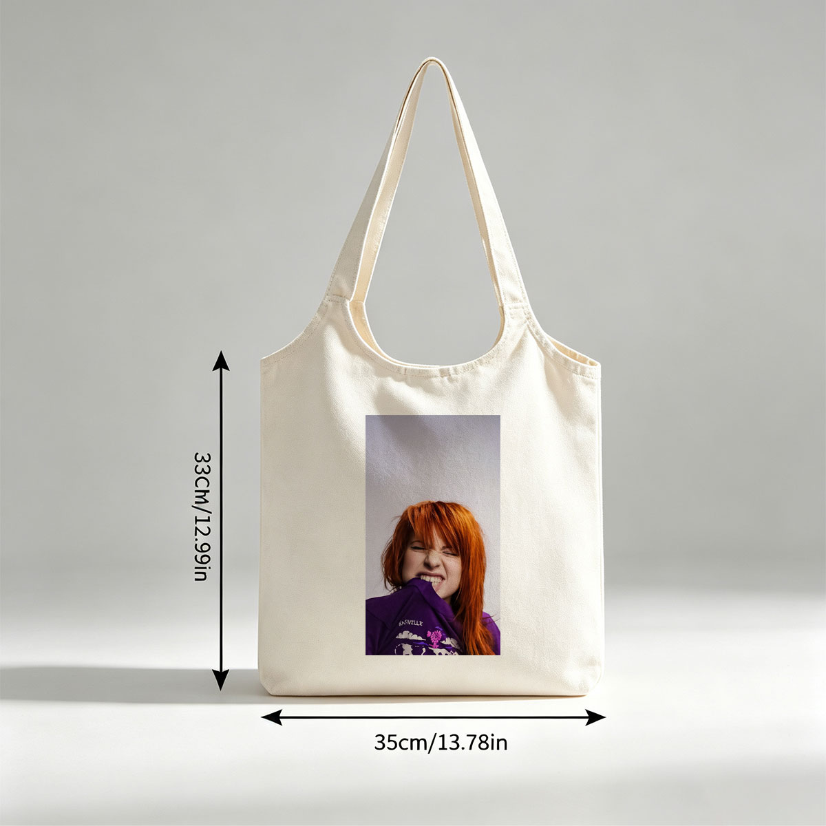 Hayley Williams from Paramore in a Playful Pose Wearing a Purple Nashville Shirt with a Vibrant Design - Canvas shoulder bags/
