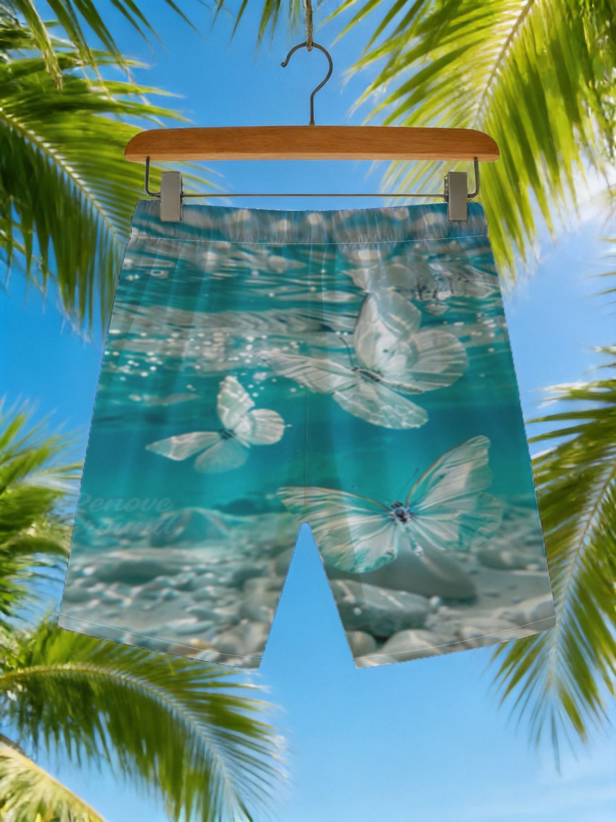 Butterflies floating underwater in clear blue water -  Beach shorts