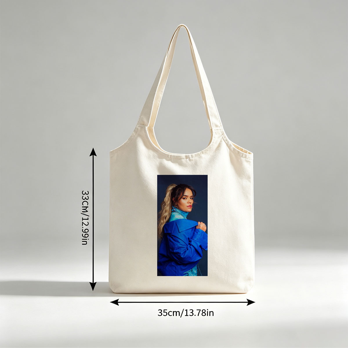 Rita Ora in Bold Blue Fashion Pose Against Dark Background - Canvas shoulder bags/