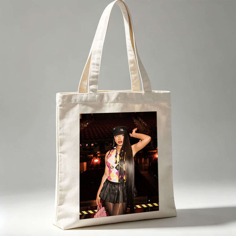 Cardi B in a Bold Outfit at a Concert Venue with Vibrant Lighting and Stage Setup - Canvas tote bags