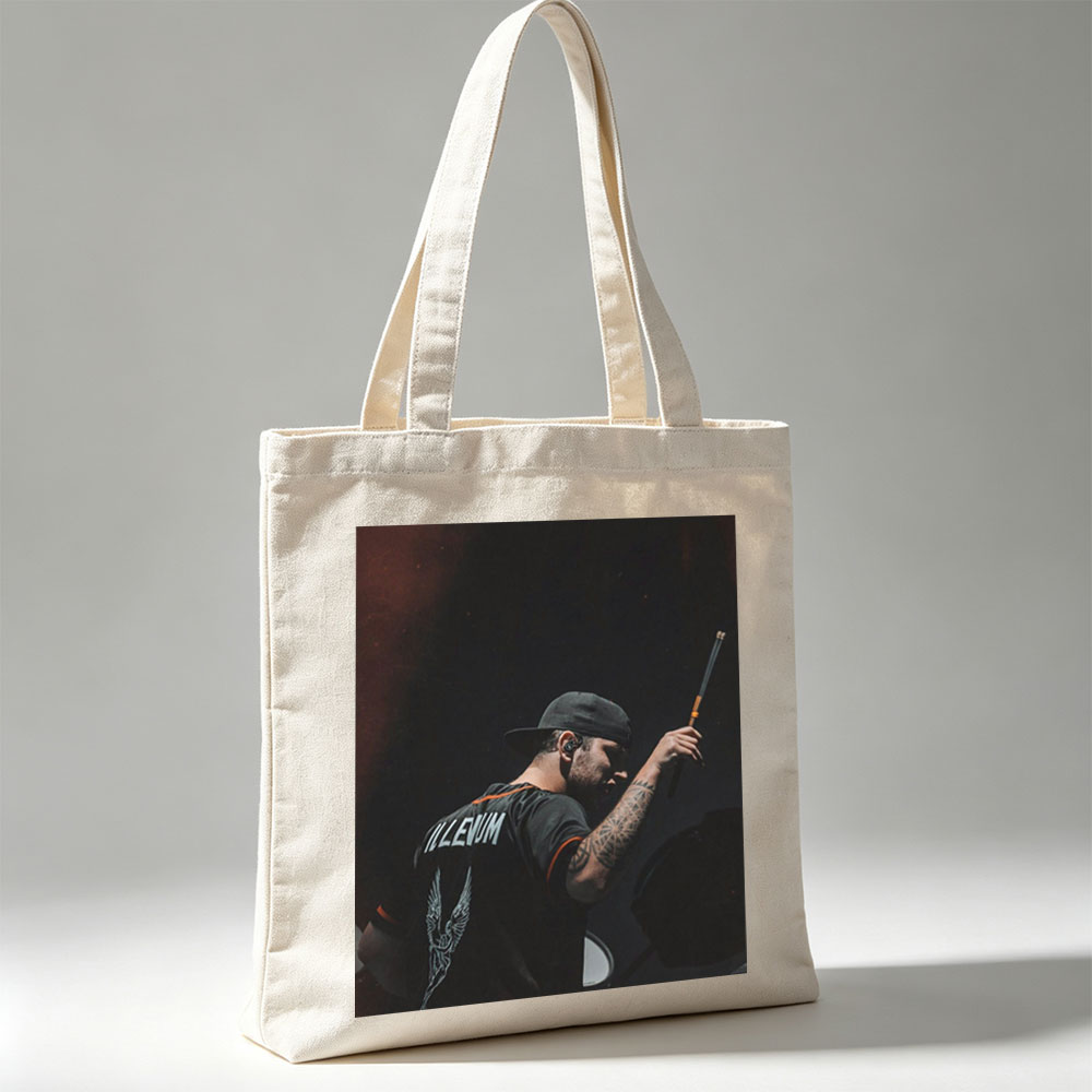 Brent Hinds of Mastodons Performing on Stage with Drumstick in Hand - Canvas tote bags