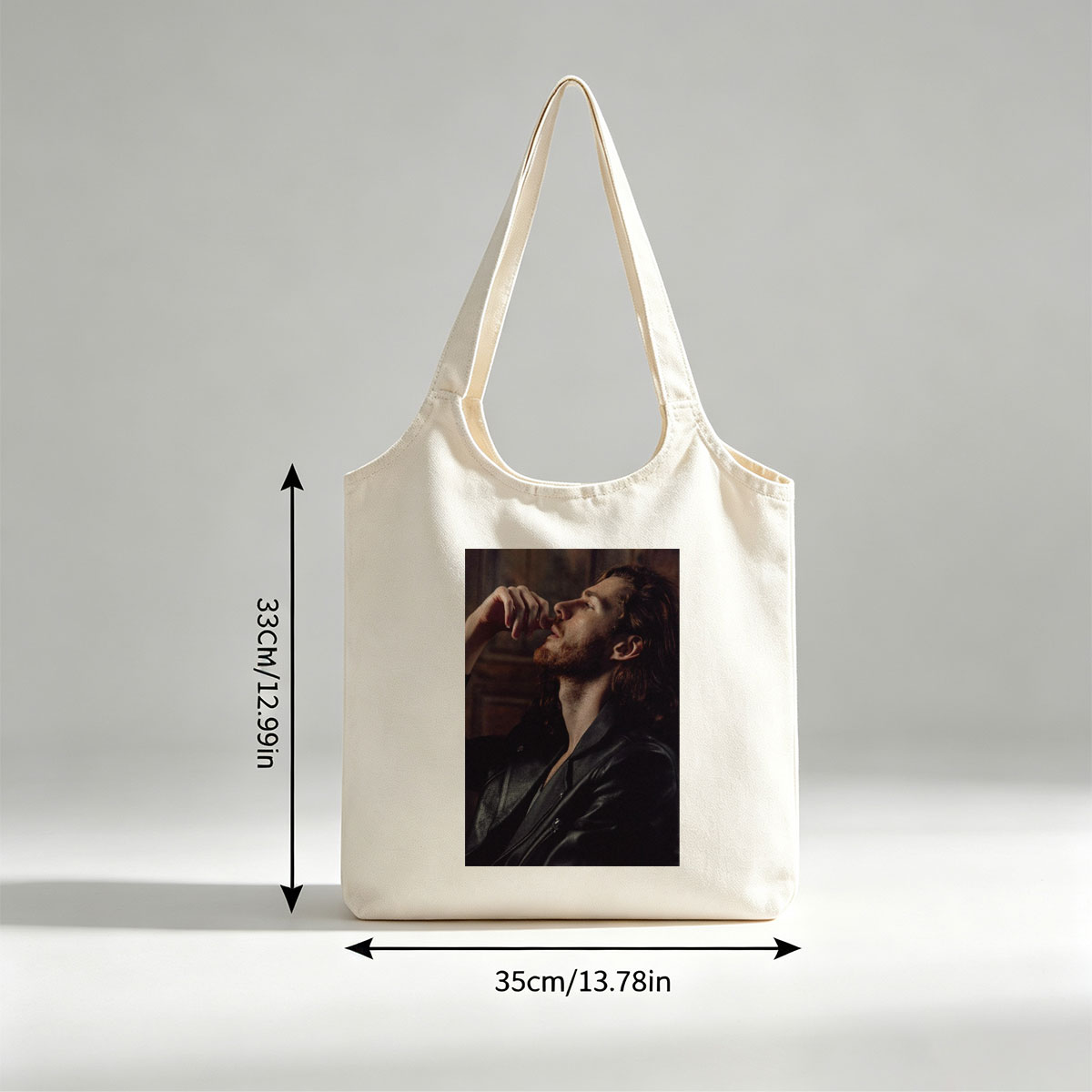 Hozier in a Moody Portrait Wearing a Leather Jacket and Gazing Upward - Canvas shoulder bags/