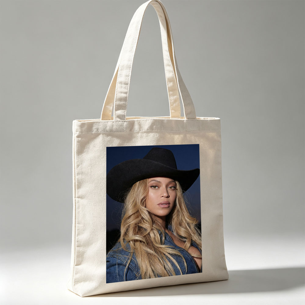 Beyonce in Cowboy Hat and Denim Jacket Against Dark Sky Background - Canvas tote bags