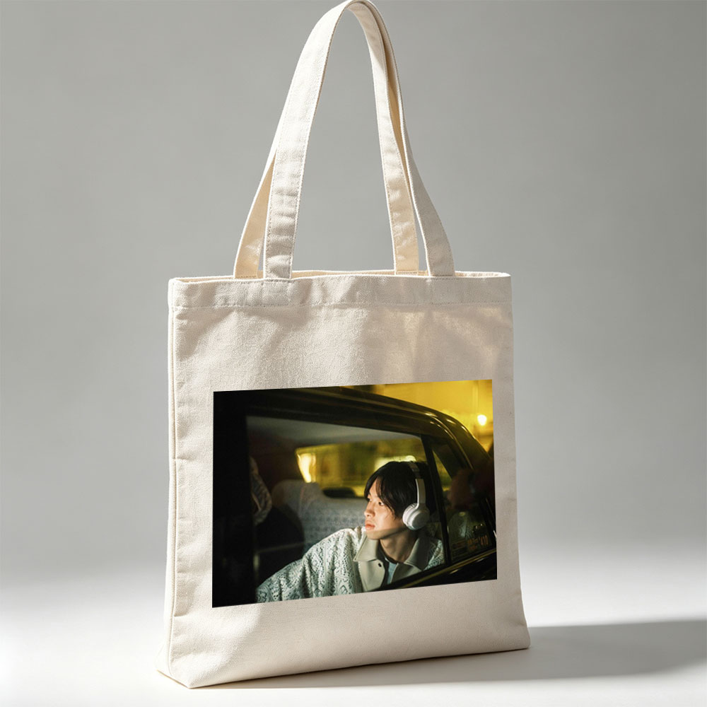 Yosuke Sugino in a Car at Night Wearing Headphones and Looking Out the Window - Canvas tote bags