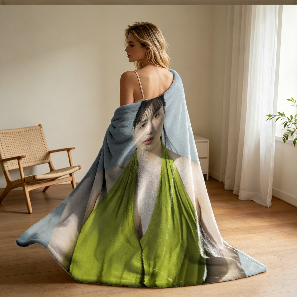 A woman in a sheer beige backless dress posing in a modern interior. - Blanket
