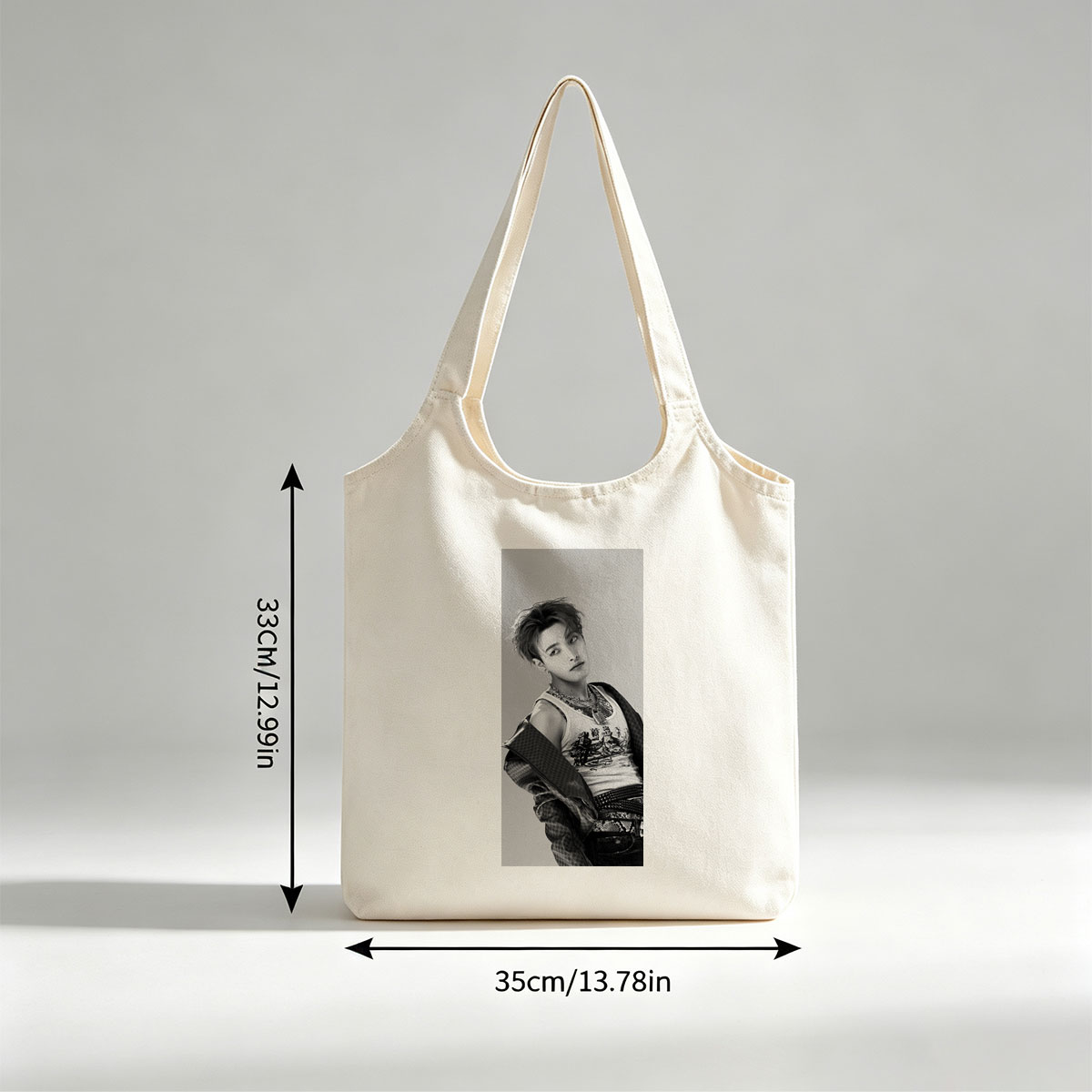 Dino from SEVENTEEN in a stylish black and white portrait wearing a graphic tank top and layered accessories. - Canvas shoulder bags/