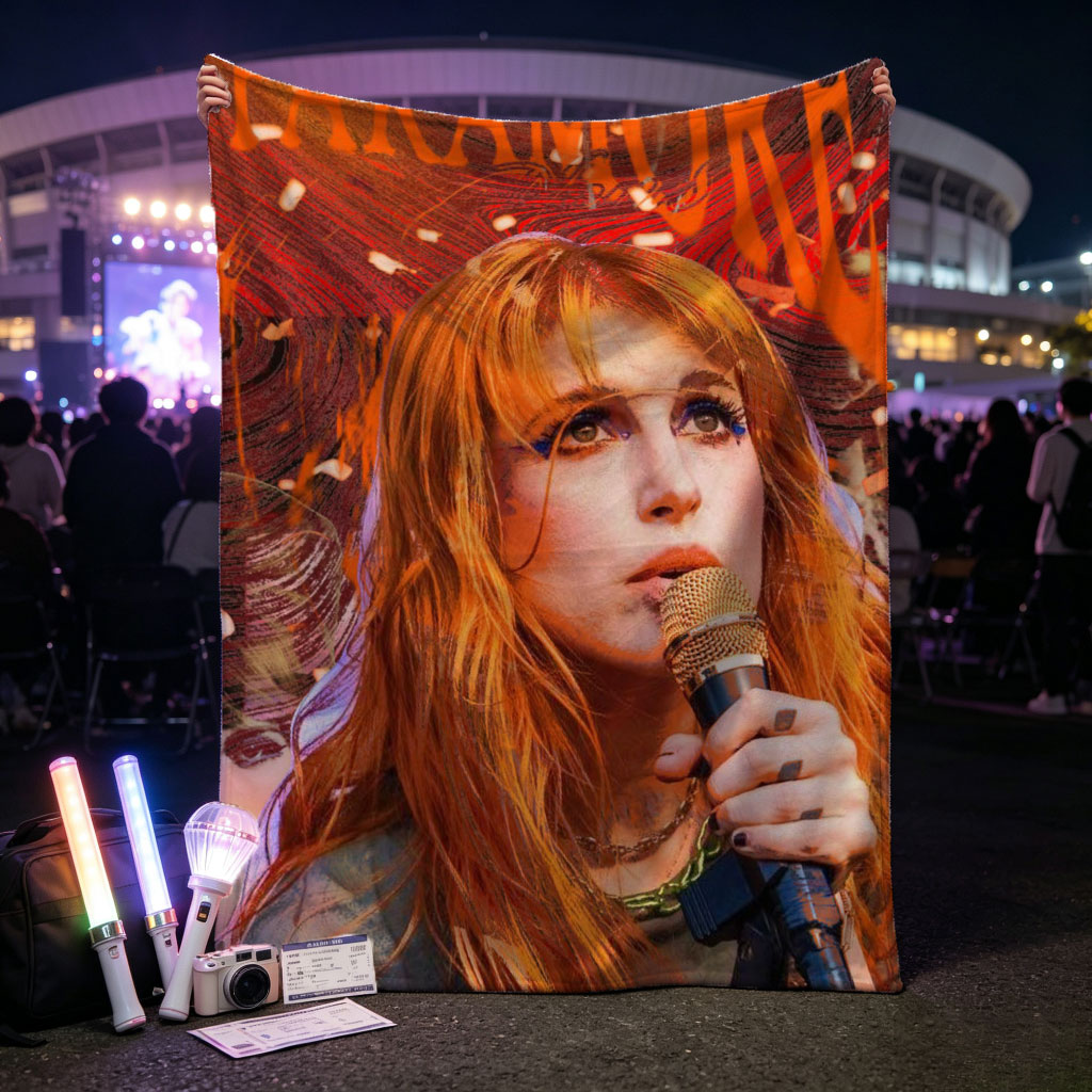 Paramore Live Performance - Hayley Williams Singing into Microphone with Vibrant Stage Background - Blankets