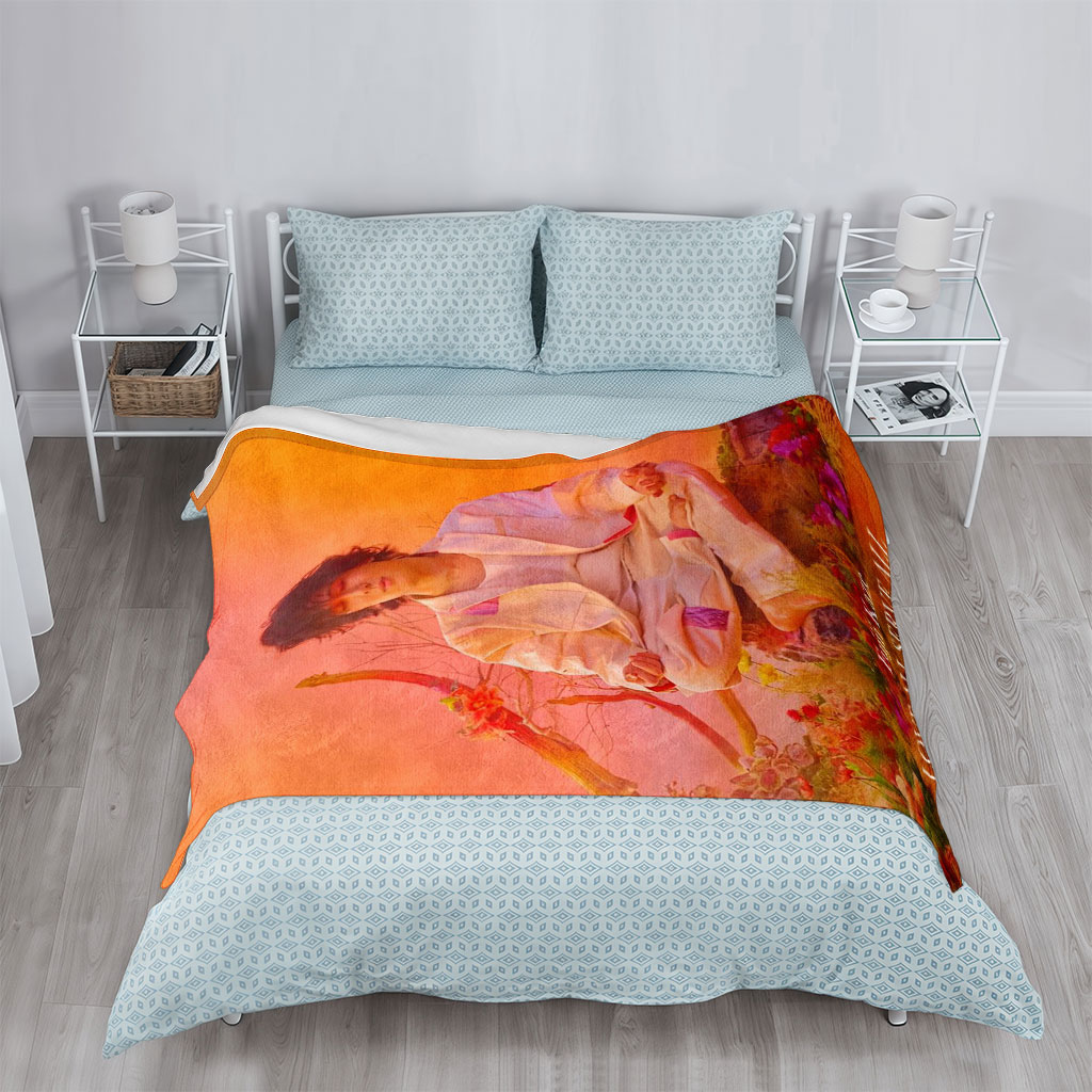 Fujii Kaze Meditating in a Vibrant Floral Landscape with Warm Sunset Background - Blankets