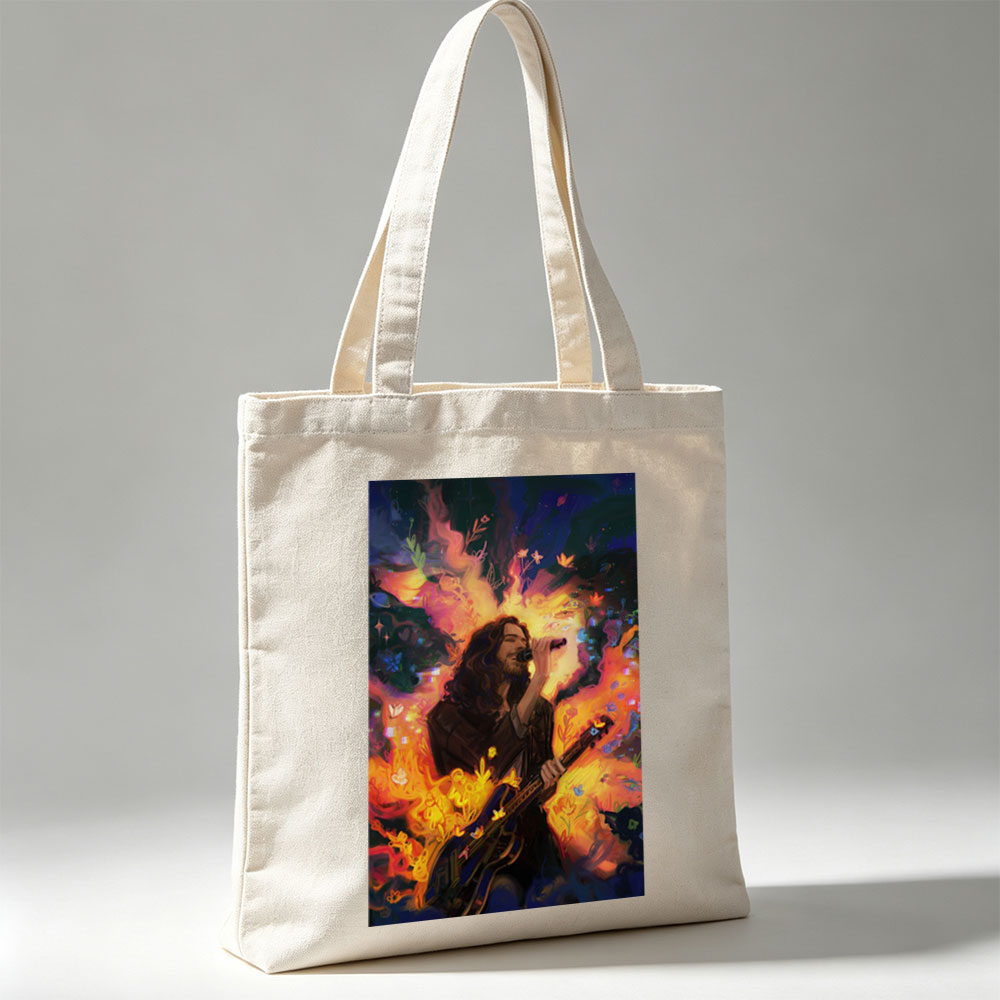 Hozier Performing with Guitar Amidst Vibrant Flames and Flowers Artwork - Canvas tote bags