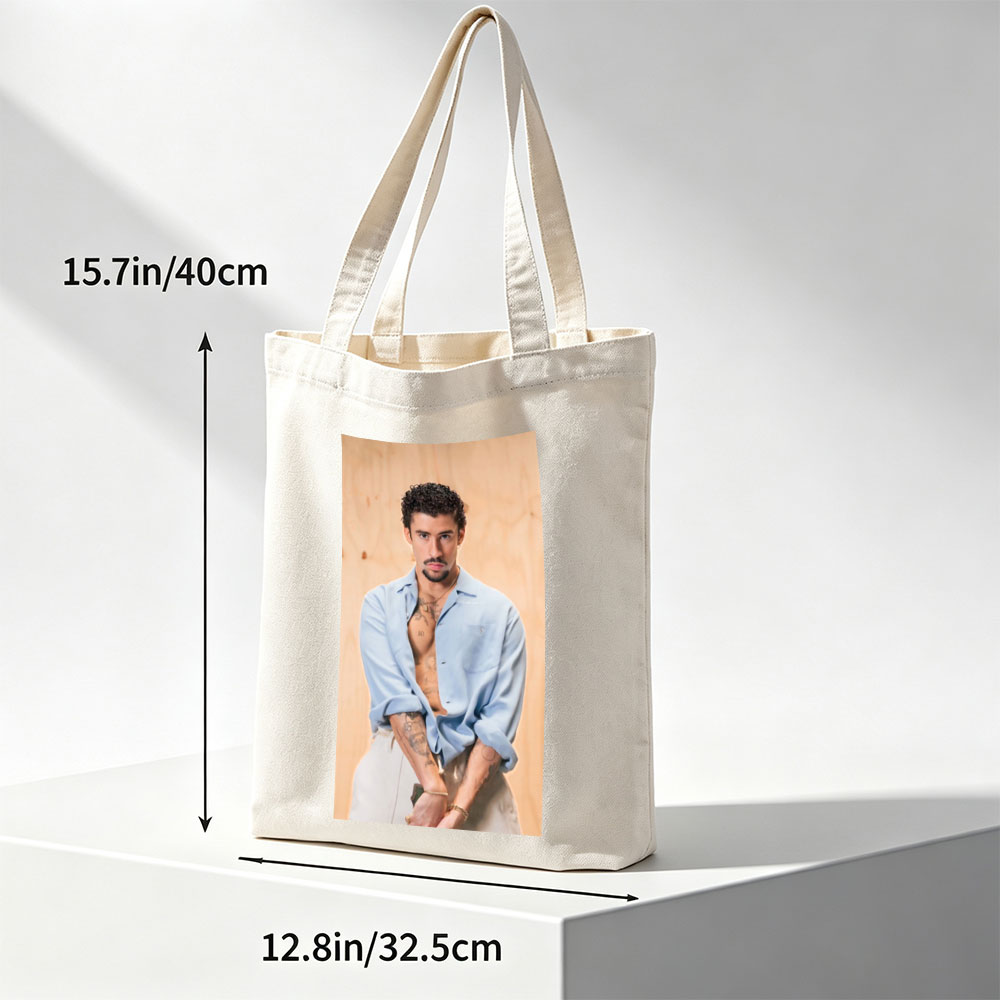 Bad Bunny in a Casual Pose Wearing an Open Light Blue Shirt and White Pants with Visible Tattoos - Canvas tote bags