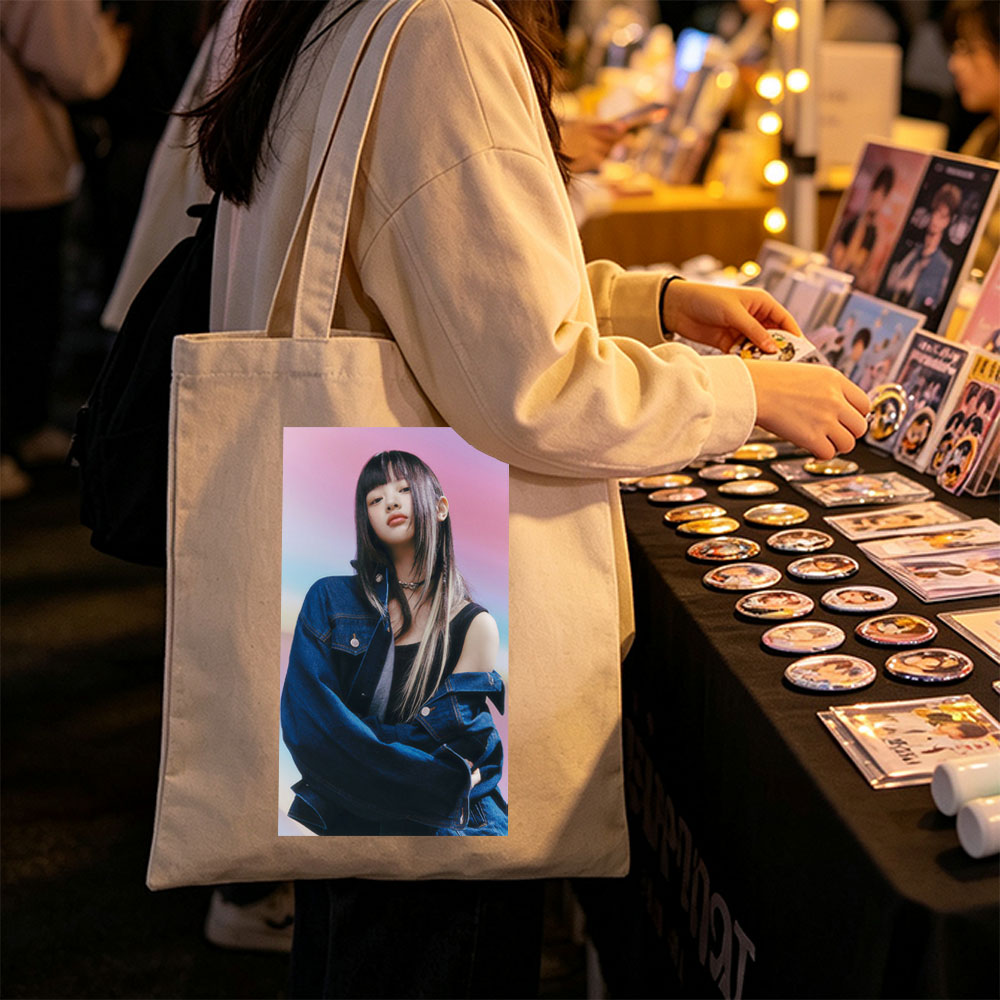 Hanni from NewJeans in a Stylish Denim Look Against a Vibrant Gradient Background - Canvas tote bags