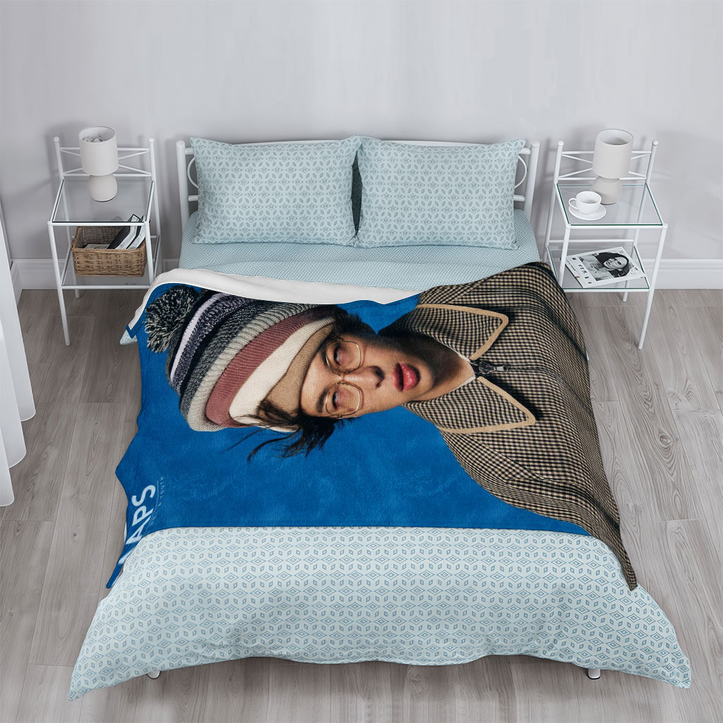 BTS Jungkook in a Stylish Winter Look with Beanie and Checkered Jacket on Blue Background - Blankets