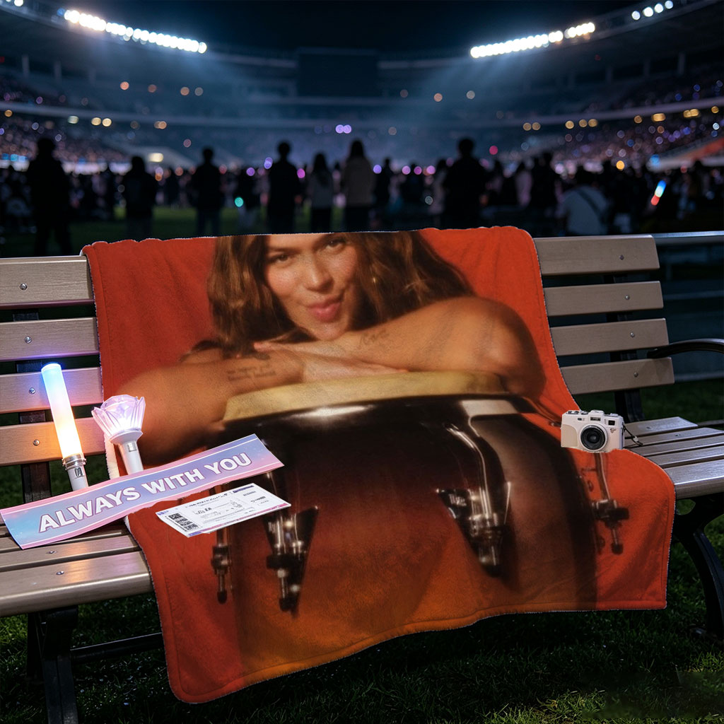 Maren Morris Leaning on a Conga Drum Against a Red Background - Blankets