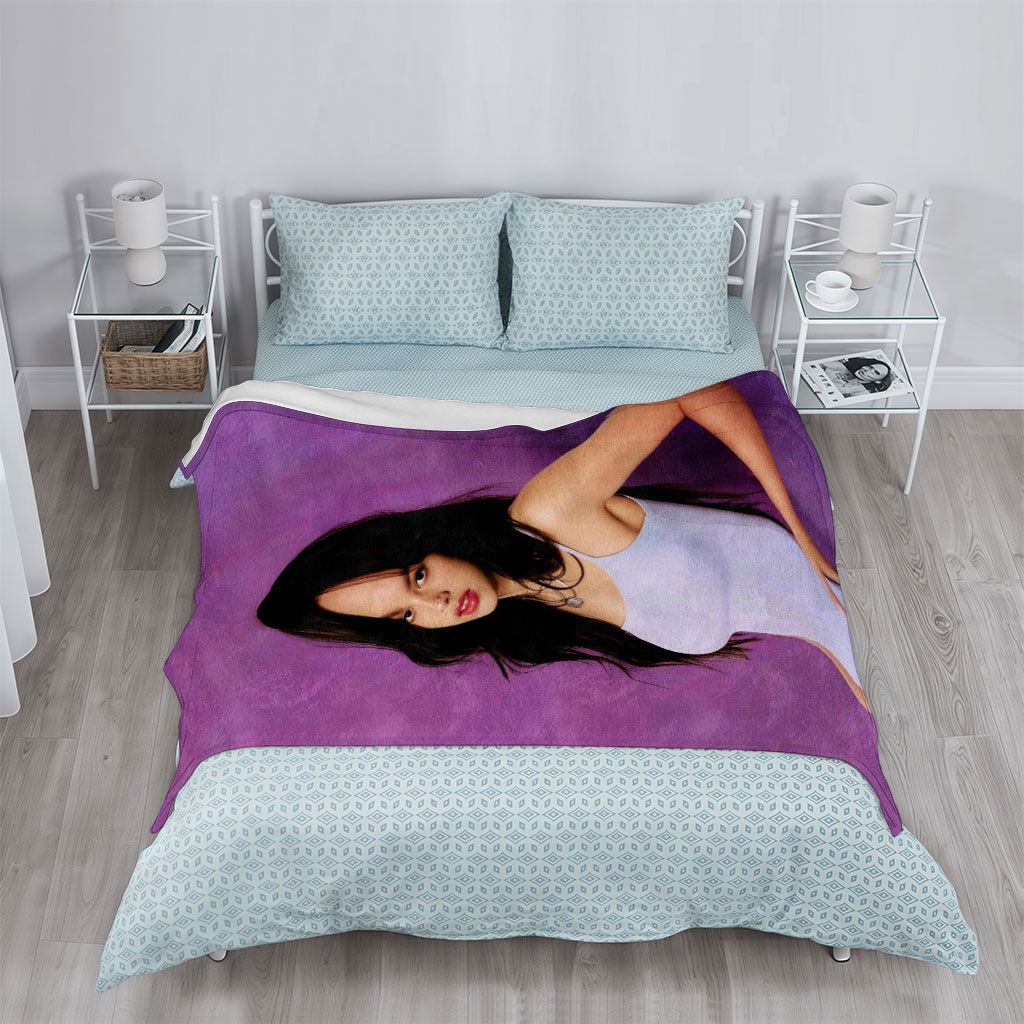 Olivia Rodrigo in a Light Blue Dress Posing Against Purple Background - Blankets