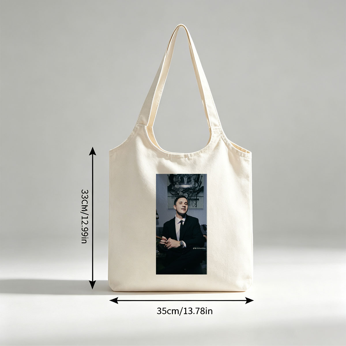 Pete Davidson in a Suit Holding a Cigar with Artwork in the Background - Canvas shoulder bags/