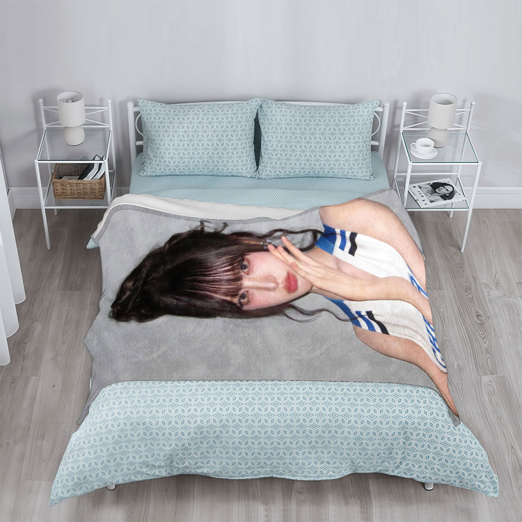 K-pop Idol in Cheerleader Outfit Poses with Hand on Face Against Gray Background - Blankets