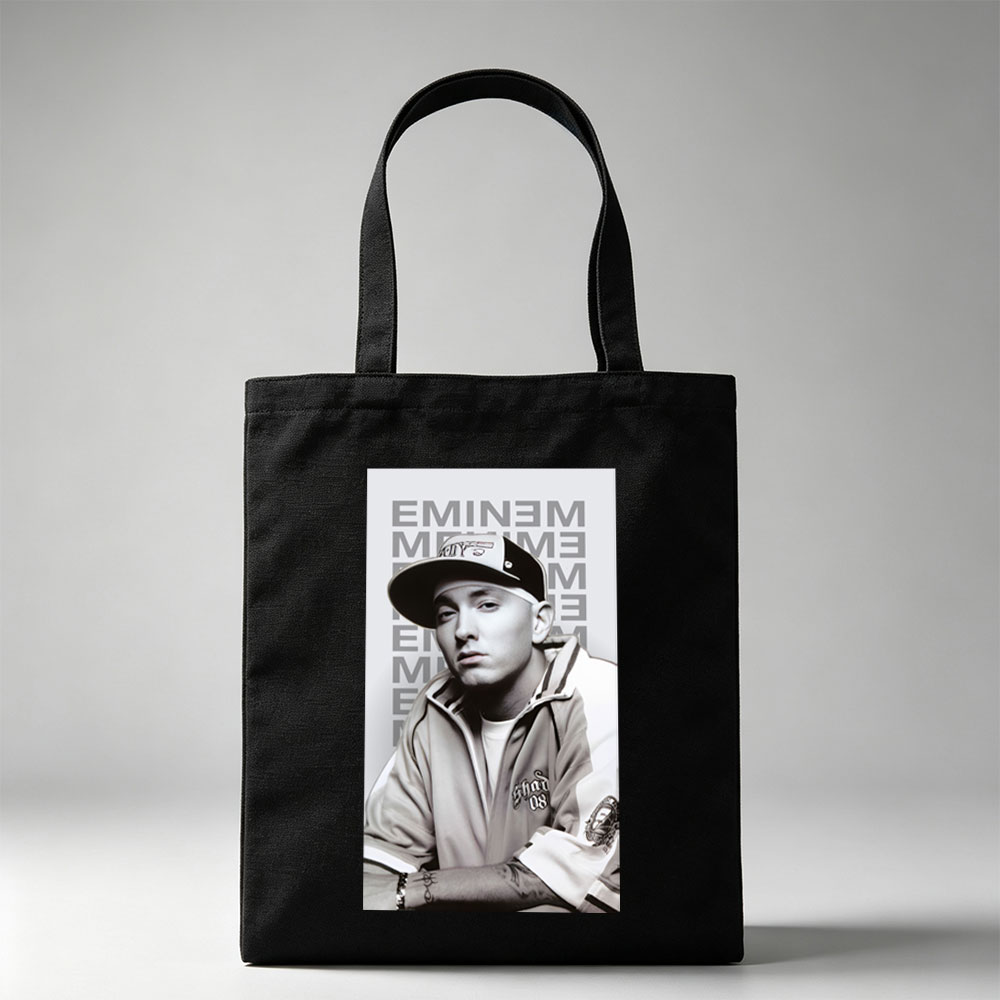 Eminem in a Casual Pose Wearing a Cap and Track Jacket with Tattooed Arms - Canvas tote bags