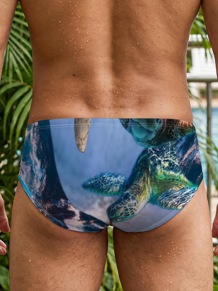 Turtles, stars, and flowers in a heart-filled ocean scene -  Men's swim trunks