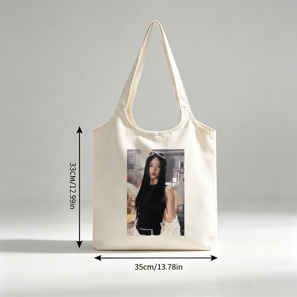 Hanni of NewJeans in a Futuristic Studio Setting Wearing a Black Top and White Ruffled Skirt with Sunglasses on Head - Canvas shoulder bags/