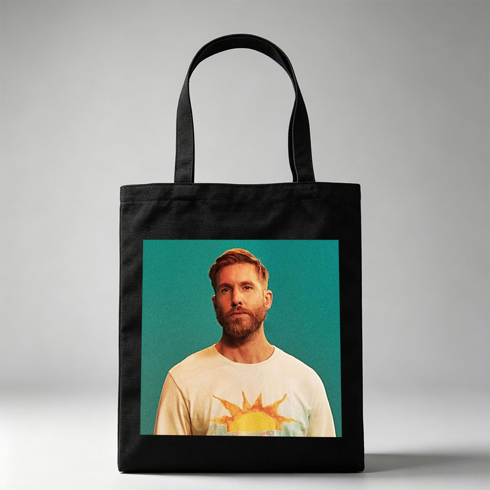 Calvin Harris in a Sun-Themed T-Shirt Against a Teal Background - Canvas tote bags