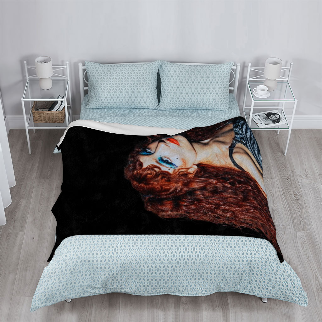 Chappell Roan in a Dramatic Pose with Vibrant Red Hair and Bold Blue Eye Makeup Against a Dark Background - Blankets