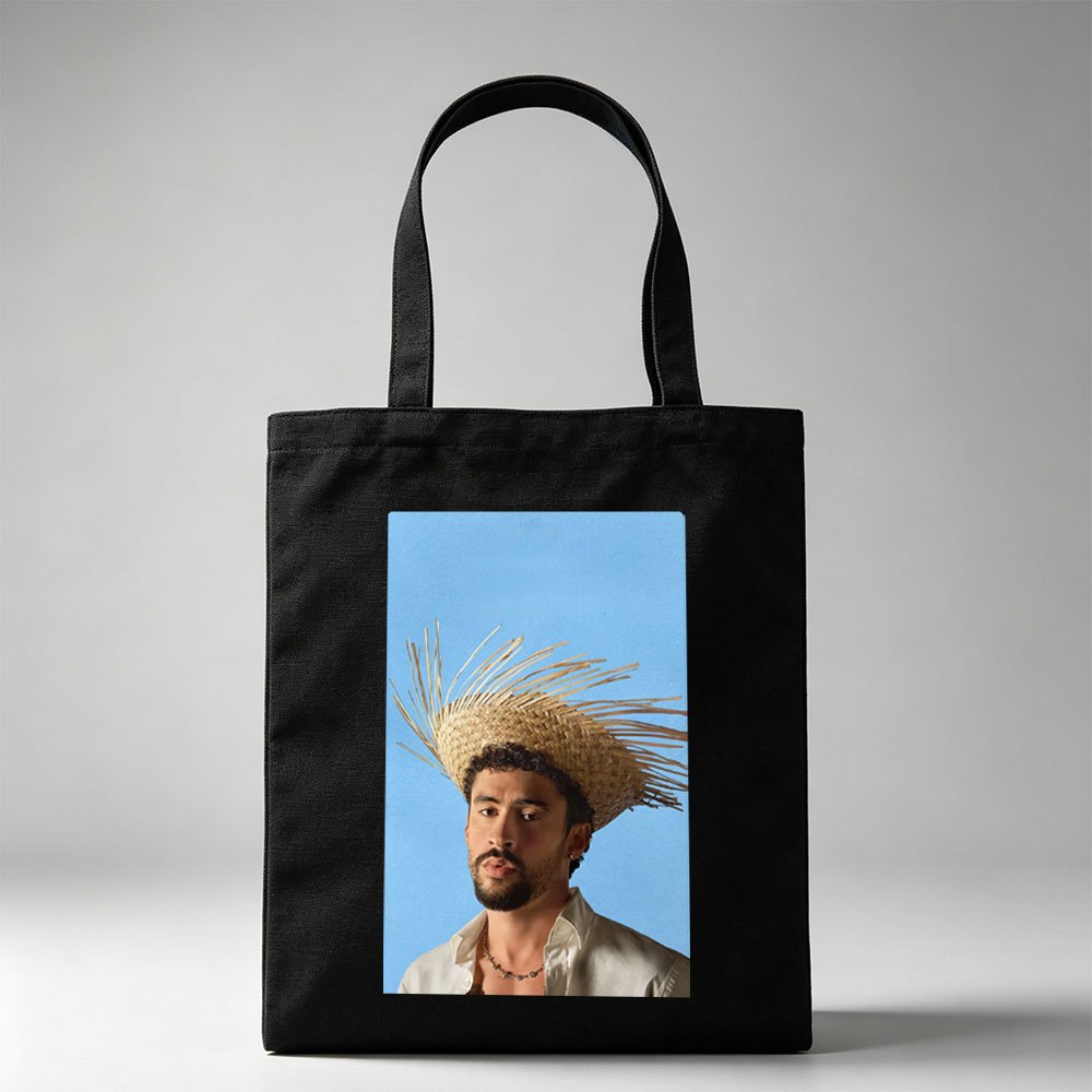 Bad Bunny Wearing a Straw Hat with Spiky Design Against a Blue Background - Canvas tote bags