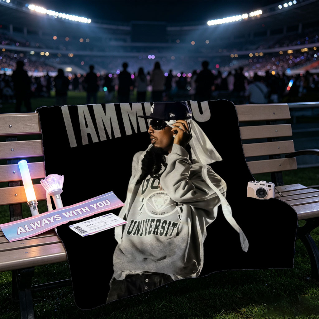 IamMusic Artist in Stylish Pose Wearing Hoodie and Cap Against Dark Background - Blankets