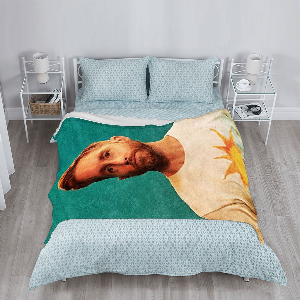 Calvin Harris in a Sun-Themed T-Shirt Against a Teal Background - Blankets