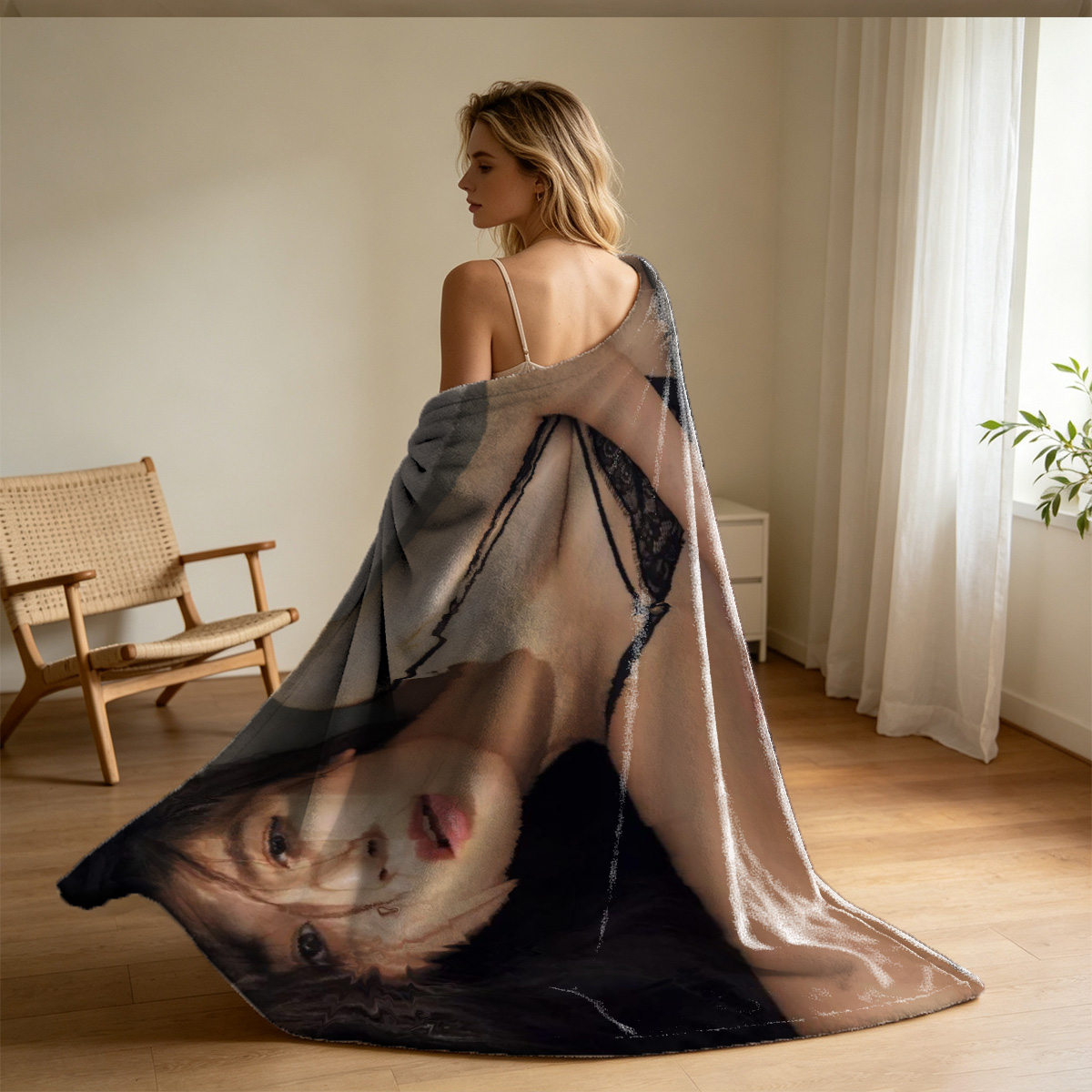 Emma Watson in a blue satin babydoll dress sitting on a red leather couch with a whip. - Blanket