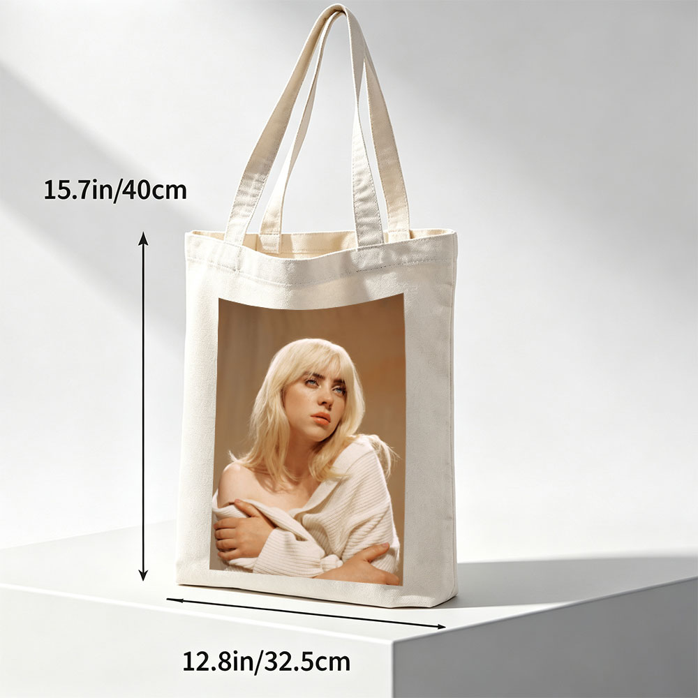 Billie Eilish in a Soft Portrait Wearing a White Off-Shoulder Sweater with Blonde Hair and Blue Eyes - Canvas tote bags
