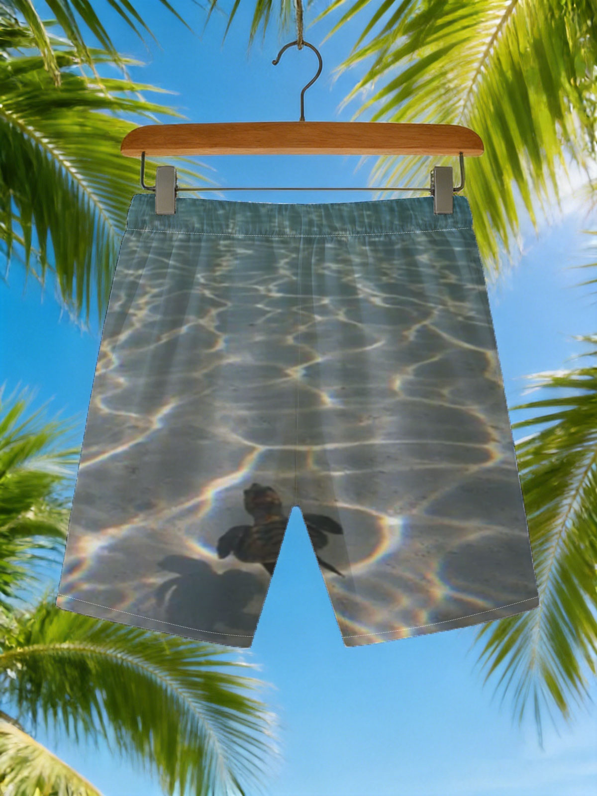 Sea turtle swimming over sandy ocean floor with sunlit ripples -  Beach shorts