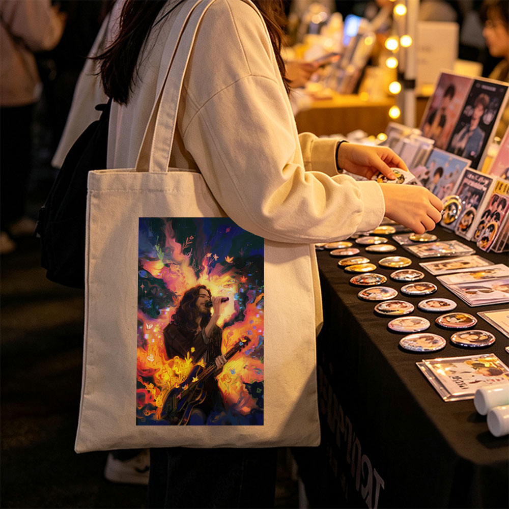 Hozier Performing with Guitar Amidst Vibrant Flames and Flowers Artwork - Canvas tote bags