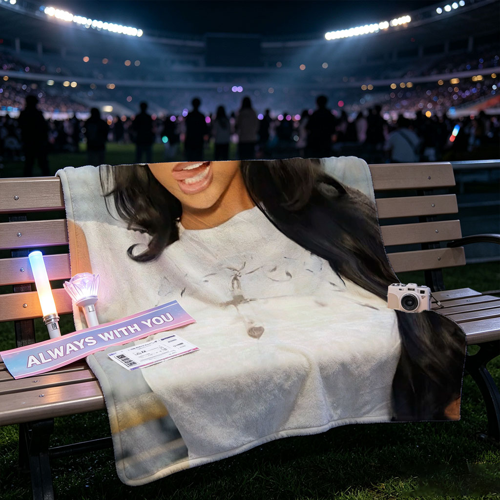 Megan Thee Stallion in a Bold Pose Wearing a White Crop Top with Cross Design and Long Black Hair Against a City Skyline Background - Blankets