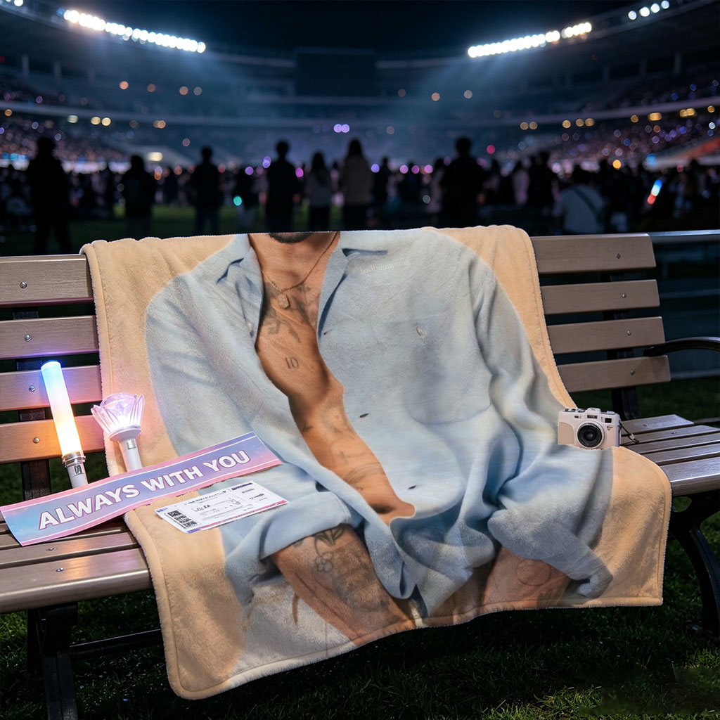 Bad Bunny in a Casual Pose Wearing an Open Light Blue Shirt and White Pants with Visible Tattoos - Blankets