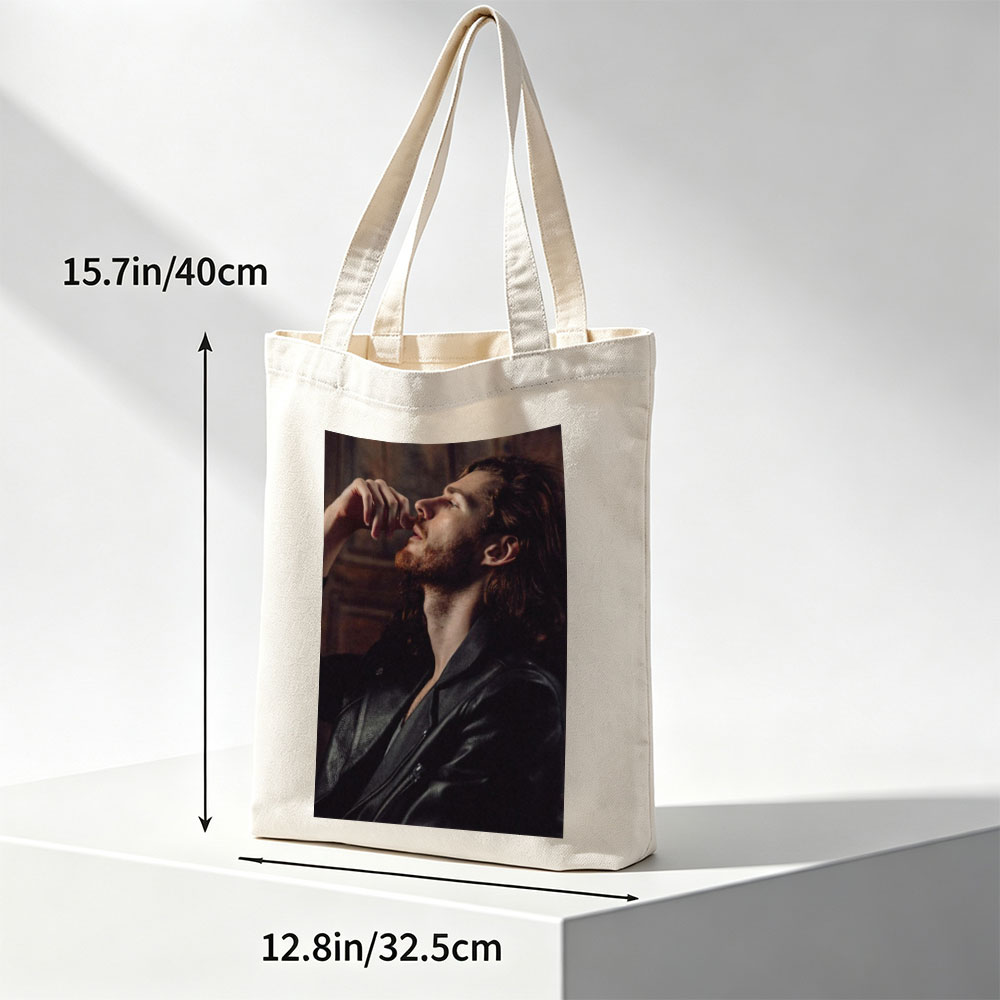 Hozier in a Moody Portrait Wearing a Leather Jacket and Gazing Upward - Canvas tote bags