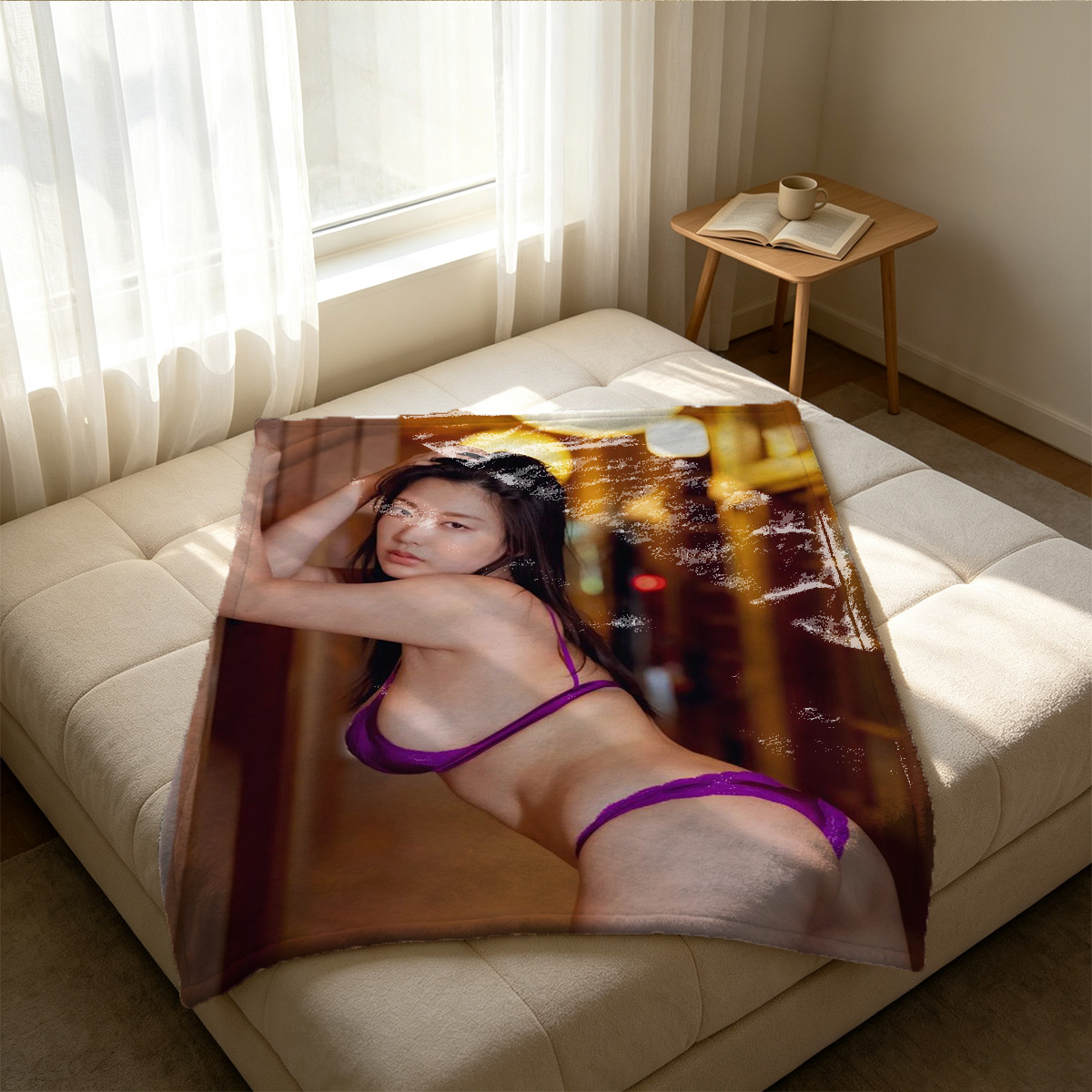 A woman in a sheer blue bikini posing on rocky cliffs by the sea. - Blanket