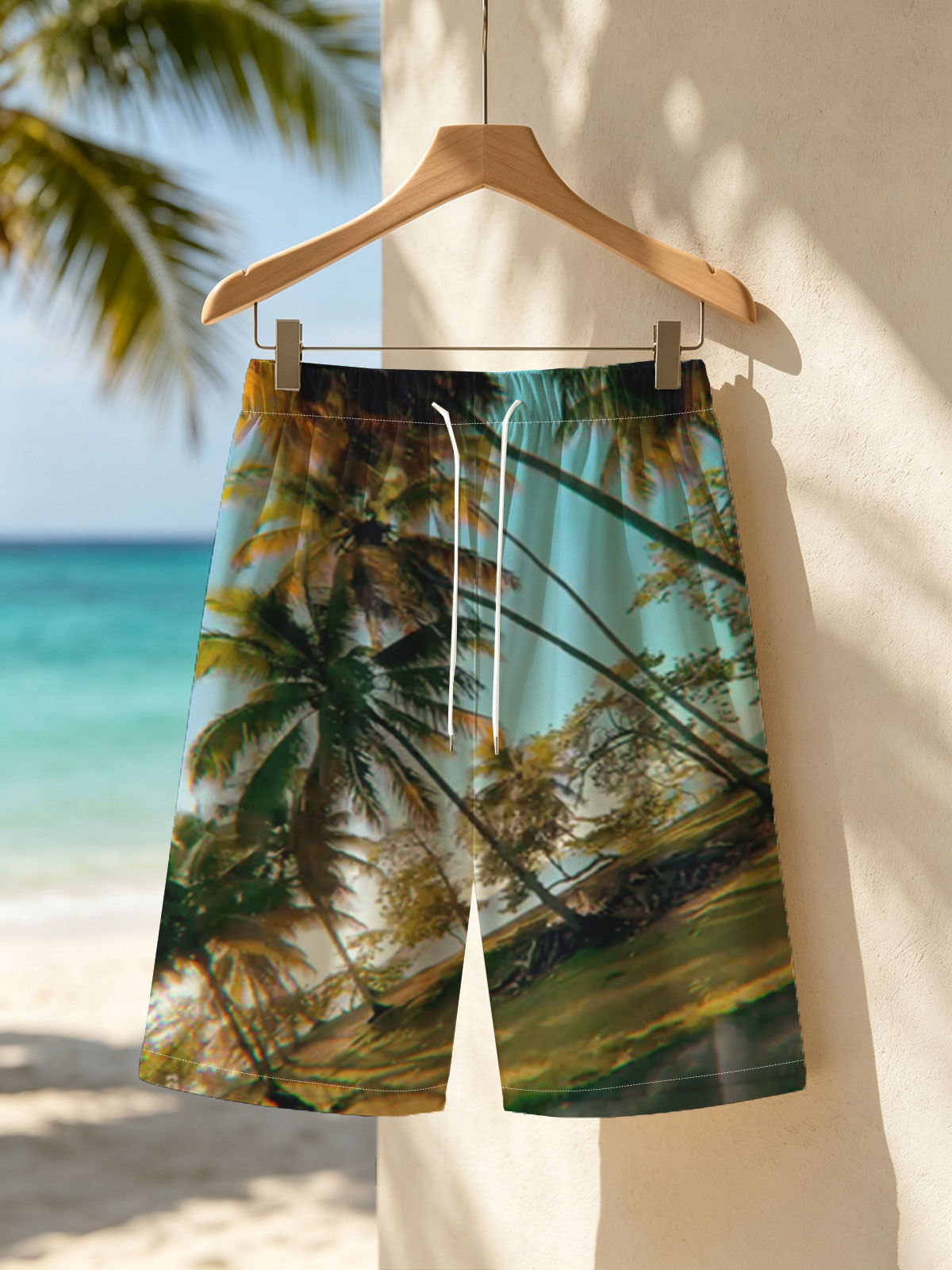 Tropical palm trees sway under a clear blue sky, casting golden shadows on the ground. -  Beach shorts